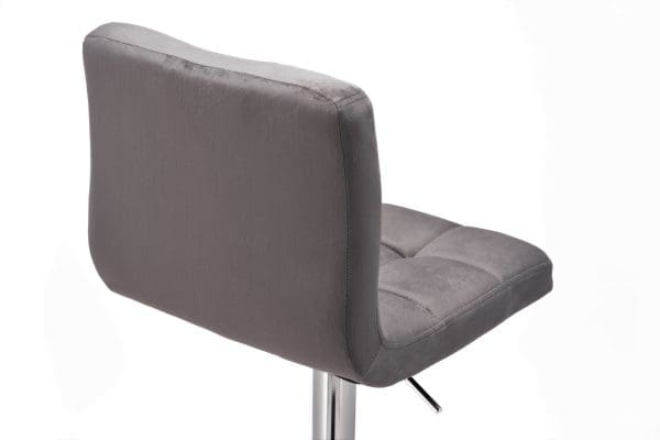 dark grey velvet bar stool behind