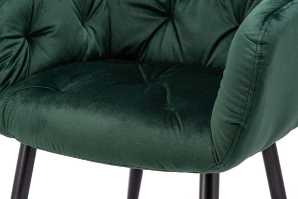 close up of dark green velvet dining chair